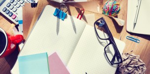 Designer's Desk with Architectural Tools and Notebook